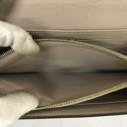 Epi Beige Twist Wallet